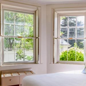 a bedroom with two windows and a bed at The Woodbridge Tasmania in New Norfolk