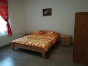 Postel nebo postele na pokoji v ubytování Sümegi Levendula Apartmanok