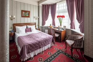 Кровать или кровати в номере Hotel Atlas Deluxe