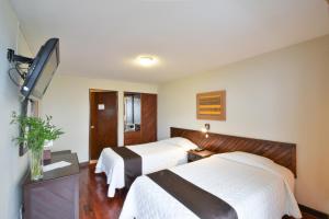 Кровать или кровати в номере Hotel Señorial
