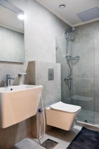 a bathroom with a sink and a shower and a toilet at salmiya - Amman -Family only in Kuwait