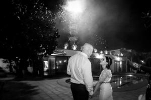 a man and a woman holding hands in front of a fountain at Quinta Don Jose Boutique Hotel in Guadalajara