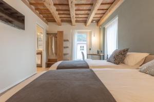 A bed or beds in a room at Borgopetra