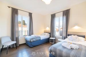 Кровать или кровати в номере Villa Artemys - Five Stars Holiday House