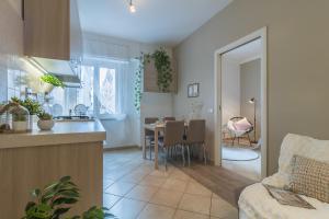a kitchen and living room with a table and a kitchen and a dining room at Vaticano San Pietro Apartment in Rome