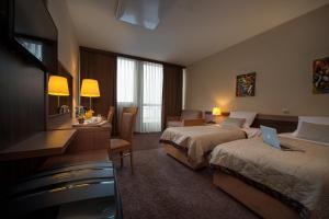 Katil atau katil-katil dalam bilik di Hotel Kras