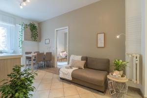 a living room with a couch and a dining room at Vaticano San Pietro Apartment in Rome