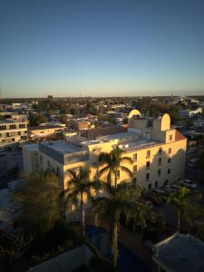 an aerial view of a building with palm trees at Best Western Hotel Plaza Matamoros in Matamoros