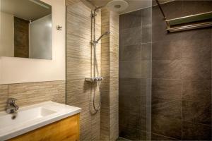 a bathroom with a shower and a sink at Aparthotel Ons Epen in Epen