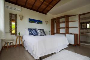Cama ou camas em um quarto em Pousada Jakuara