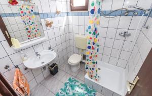 a small bathroom with a toilet and a sink at Apartmani Jadra in Stara Novalja +13 photos