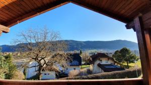 a view from a window of a house at Ossiachersee Apartments in Steindorf am Ossiacher See
