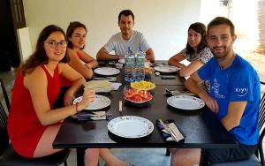 a group of people sitting at a table eating food at Kottamba Yala Stay & Safari in Tissamaharama