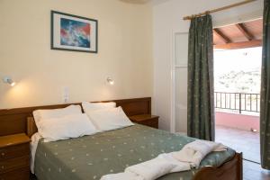 Postel nebo postele na pokoji v ubytování Moros Apartments