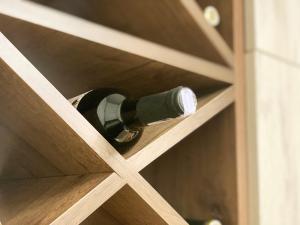a bottle of wine is sitting in a drawer at Brand new comfortable apartments in Sevan city in Sevan