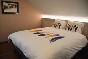 Postel nebo postele na pokoji v ubytování Plumes et Pinceaux