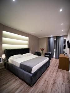 Postel nebo postele na pokoji v ubytování Light Hotel
