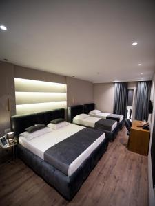 Postel nebo postele na pokoji v ubytování Light Hotel