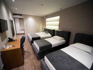 Postel nebo postele na pokoji v ubytování Light Hotel