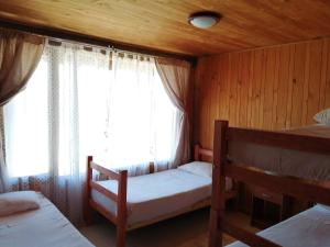 Llit o llits en una habitació de Hotel Green Papudo