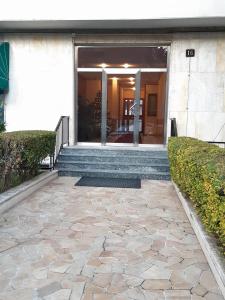 a stone walkway in front of a building at Suite Rent Milan 2 in Milan