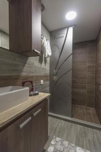 a bathroom with a sink and a shower at Nina in Banja Koviljača