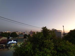 a view of a city with the sunset in the background at Khách Sạn Thiên Phong in Buon Ma Thuot
