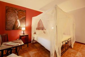 Un ou plusieurs lits dans un hébergement de l'établissement Mediterraneo Boutique Hotel