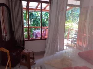 A bed or beds in a room at Littleadems View