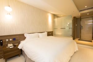 Letto o letti in una camera di Walker Hotel. Ximen
