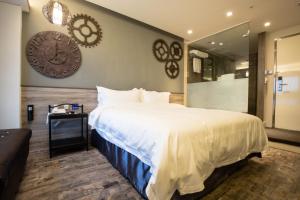 Letto o letti in una camera di Walker Hotel. Ximen
