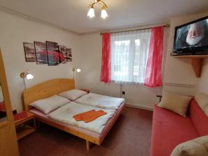 Postel nebo postele na pokoji v ubytování Penzión Poľana