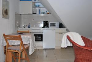 Kuchyň nebo kuchyňský kout v ubytování Haus Heidehof Whg. 17 + 4 fotografie