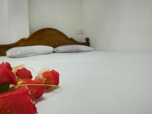 מיטה או מיטות בחדר ב-The Peak Residence