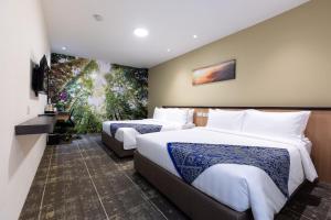 Postel nebo postele na pokoji v ubytování Hotel 7 Suria