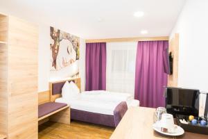 Katil atau katil-katil dalam bilik di Hotel Stiegler Bed & Breakfast