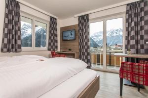 Postel nebo postele na pokoji v ubytování Haus Garni Luggi Leitner