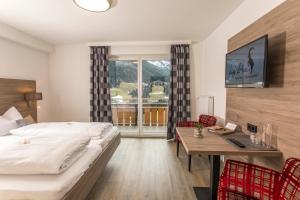 Postel nebo postele na pokoji v ubytování Haus Garni Luggi Leitner