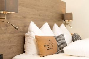 Postel nebo postele na pokoji v ubytování Haus Garni Luggi Leitner