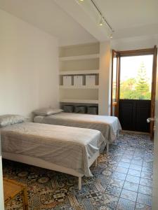 Ένα ή περισσότερα κρεβάτια σε δωμάτιο στο Sampierimare