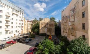 a view of a city street with buildings and cars at Nevsky Loft Studio in Saint Petersburg