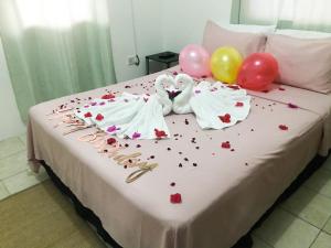 a bed with balloons andeddy bears and balloons on it at Caribbean Dream Vacation Property CD1 in Gros Islet