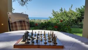 a chess board on top of a table at Villa Melenia in Almiros Beach