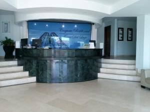 a lobby with stairs and a large screen at Torres del lago Pegasus Group Cartagena in Cartagena de Indias