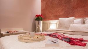 Postel nebo postele na pokoji v ubytování B&B PISTOIA INN