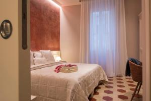 Postel nebo postele na pokoji v ubytování B&B PISTOIA INN