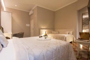 Postel nebo postele na pokoji v ubytování B&B PISTOIA INN