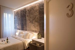 Postel nebo postele na pokoji v ubytování B&B PISTOIA INN