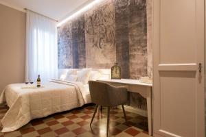 Postel nebo postele na pokoji v ubytování B&B PISTOIA INN