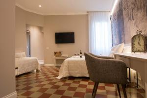 Postel nebo postele na pokoji v ubytování B&B PISTOIA INN